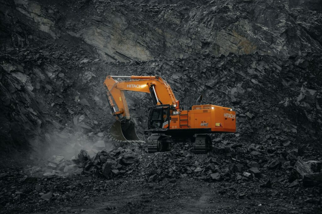 Heavy mining truck on a haul road, representing the drive and conveying equipment pulleys and sheaves support