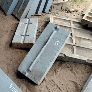 Cast mill liner bars, marked with pattern numbers